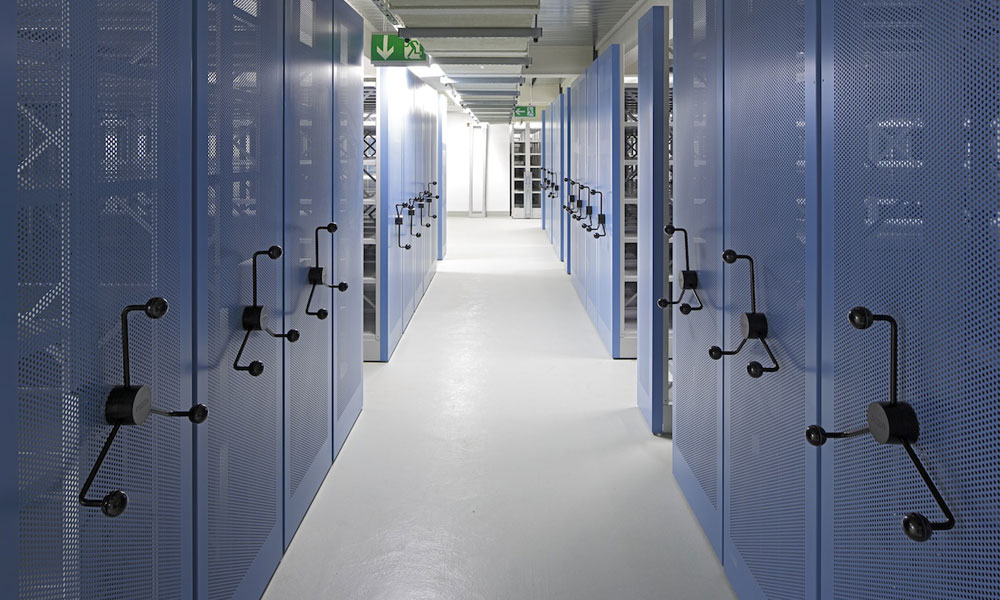 Mobile archive shelving with crank drive and blue perforated end panels